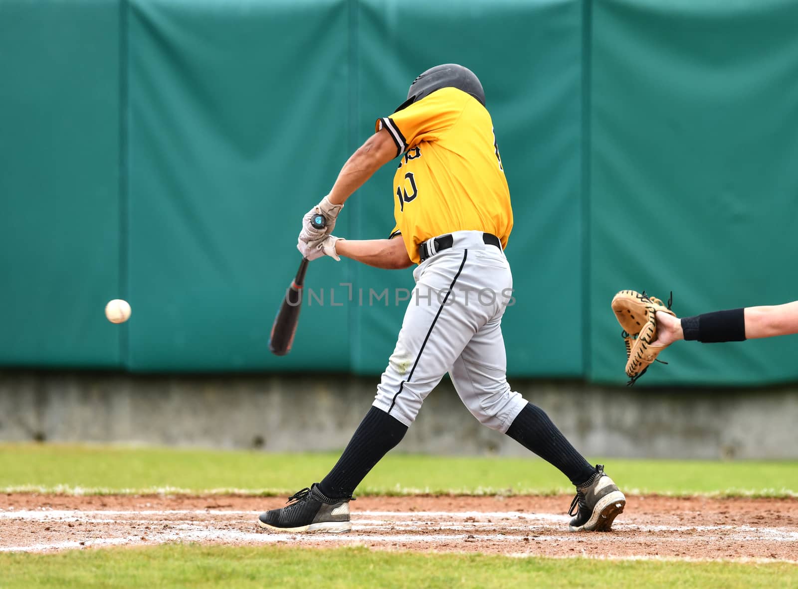 Action photo of high school baseball players making amazing plays during a baseball game