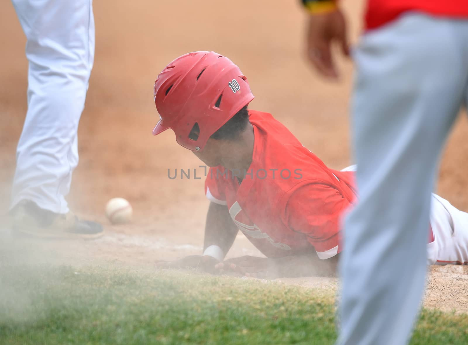 Action photo of high school baseball players making amazing plays during a baseball game