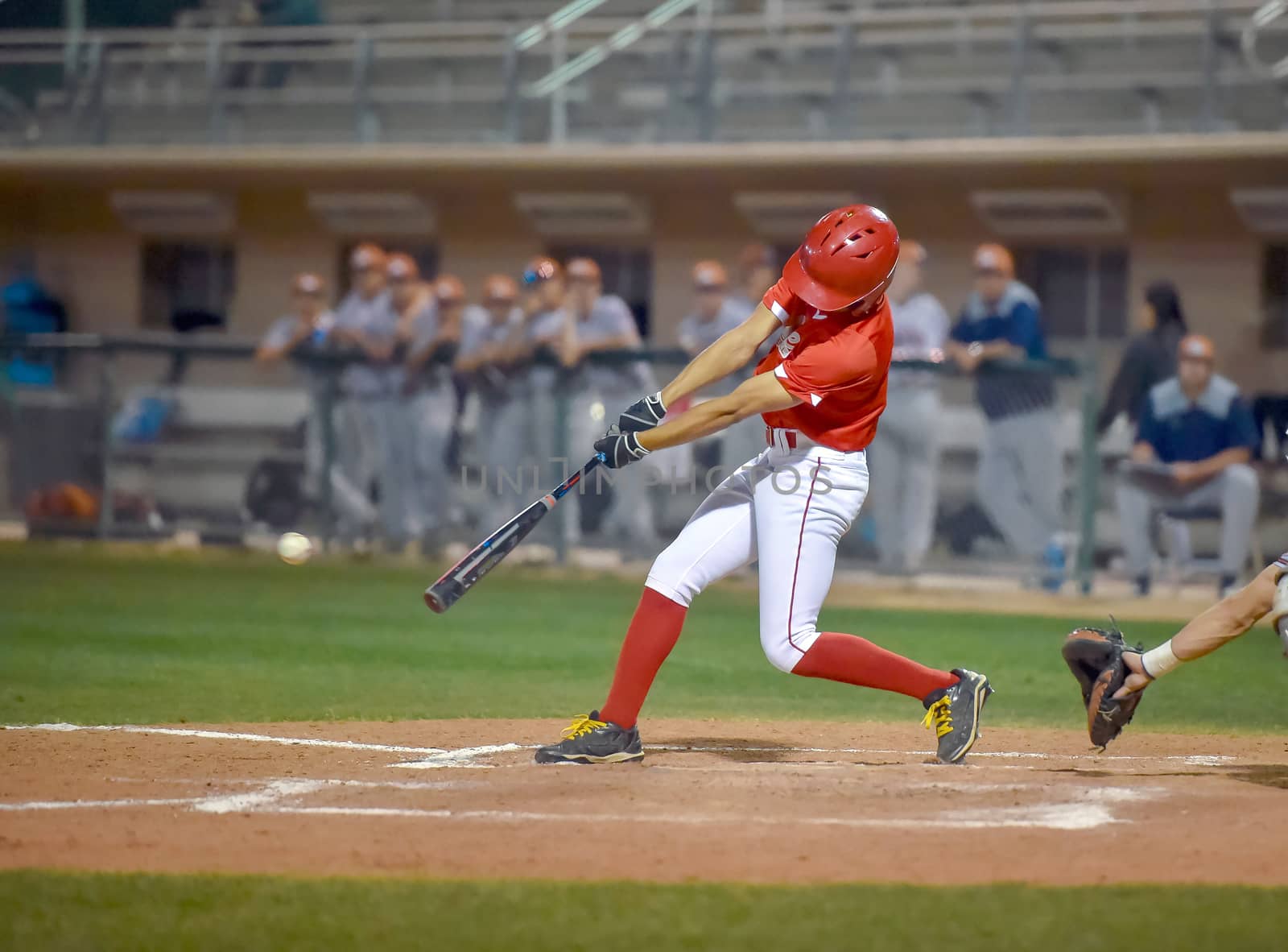 Action photo of high school baseball players making amazing plays during a baseball game