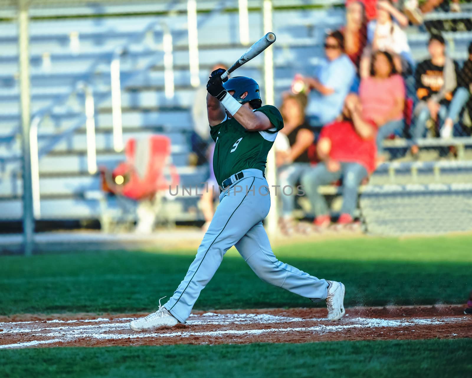 Action photo of high school baseball players making amazing plays during a baseball game