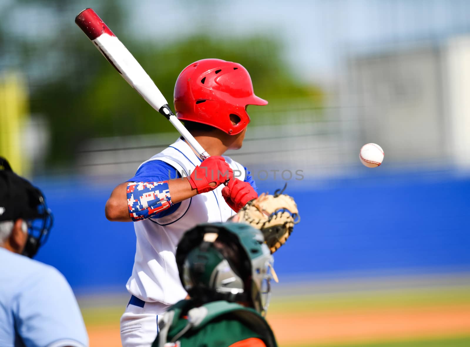 Action photo of high school baseball players making amazing plays during a baseball game