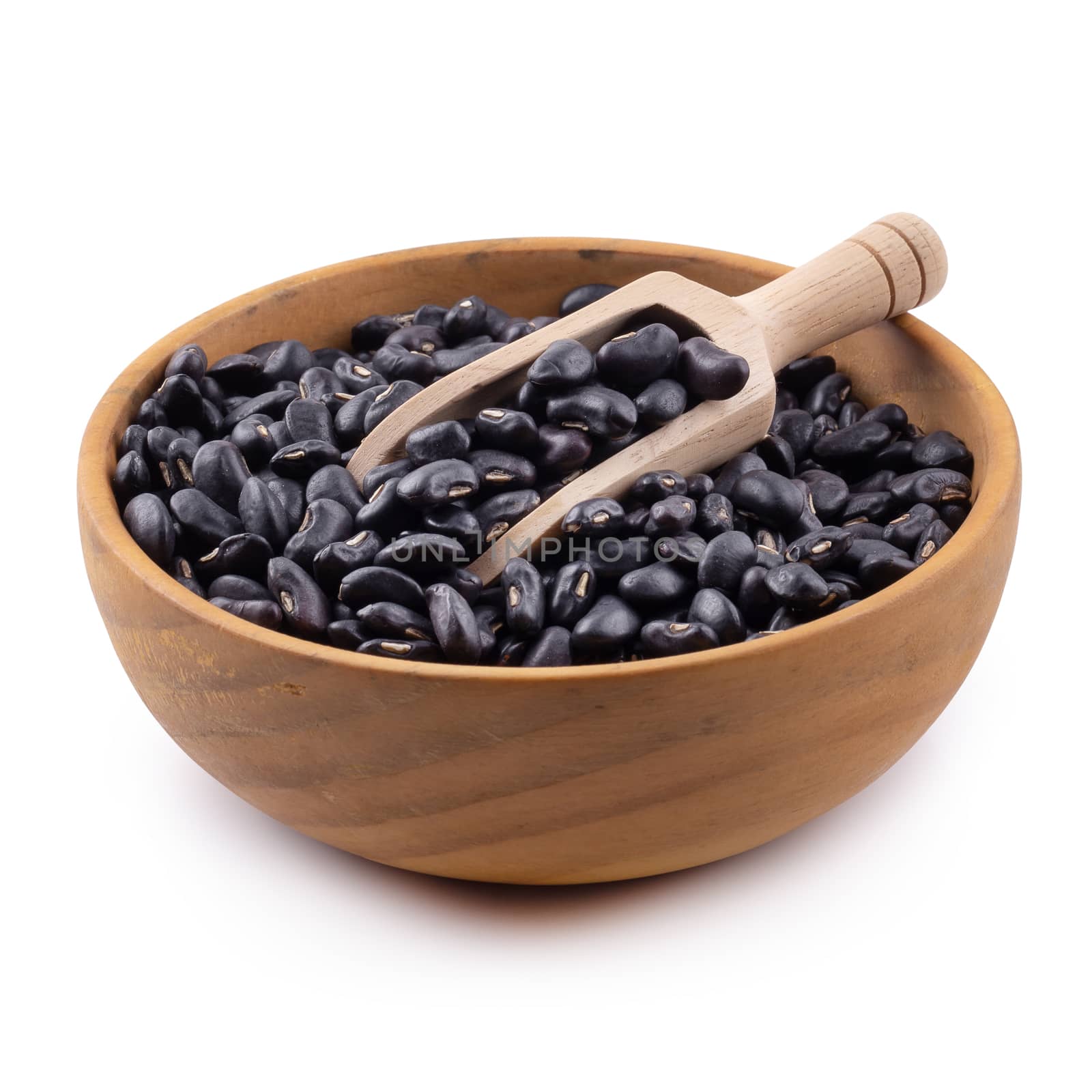 Black bean in a wooden bowl isolated on white background.
