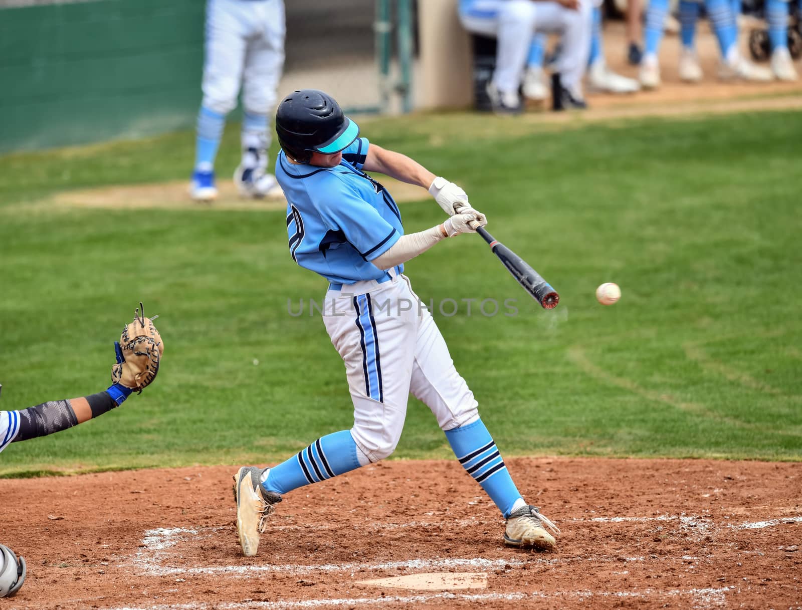 Action photo of high school baseball players making amazing plays during a baseball game