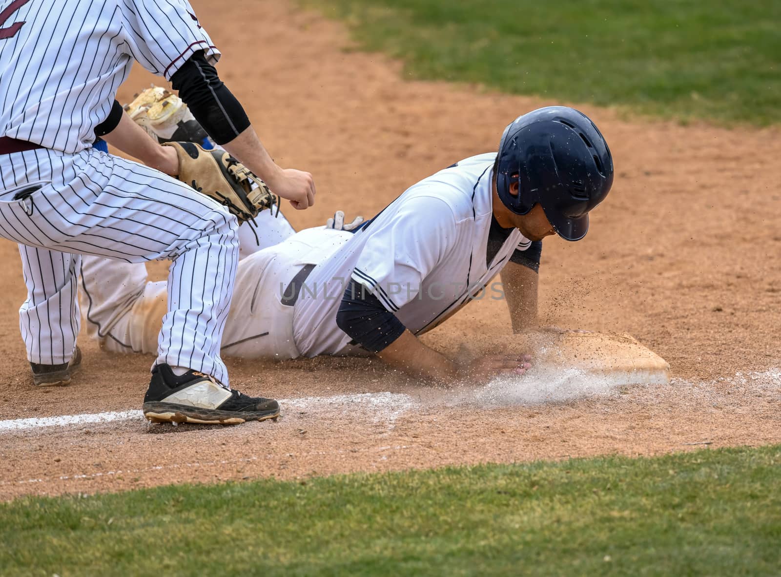 Young athletic boy playing baseball by Calomeni