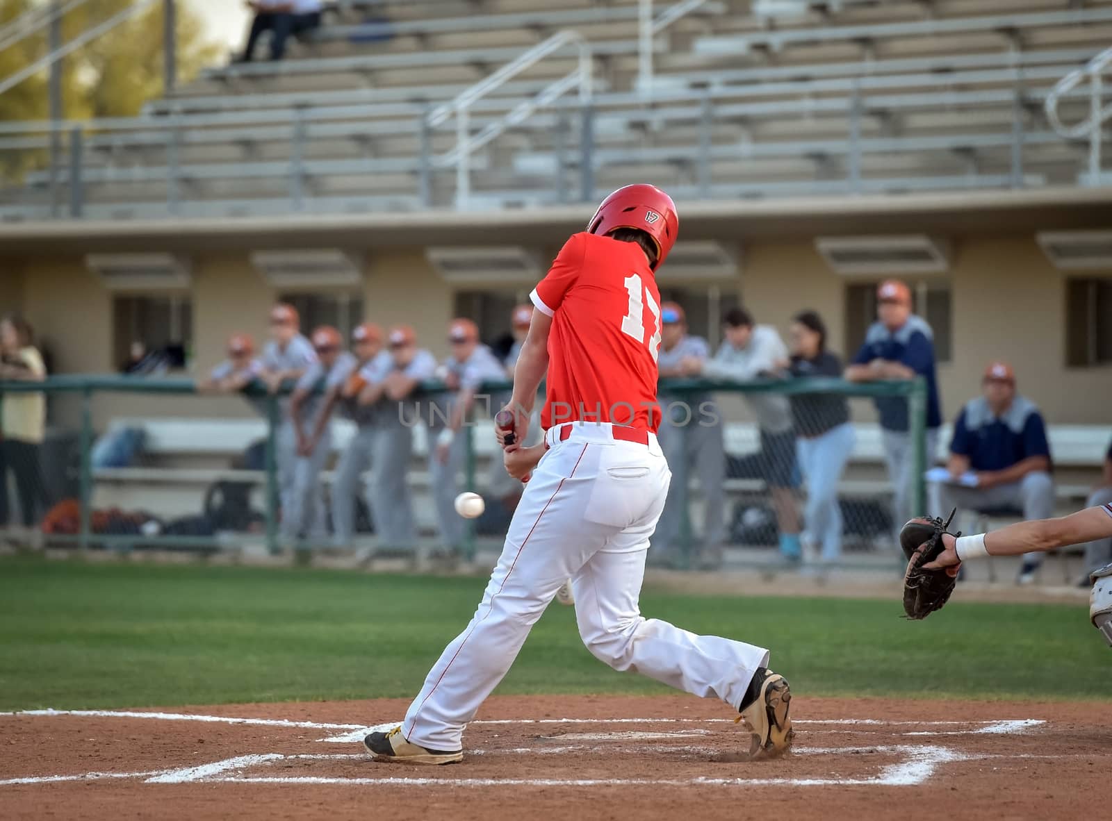 Action photo of high school baseball players making amazing plays during a baseball game