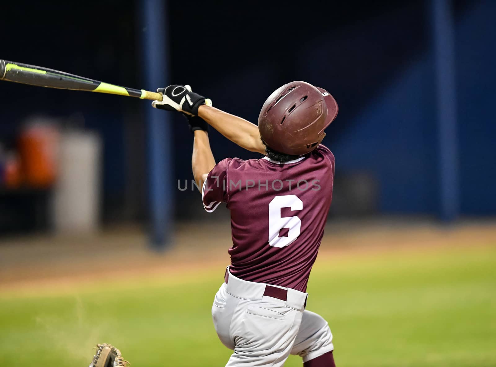 Action photo of high school baseball players making amazing plays during a baseball game