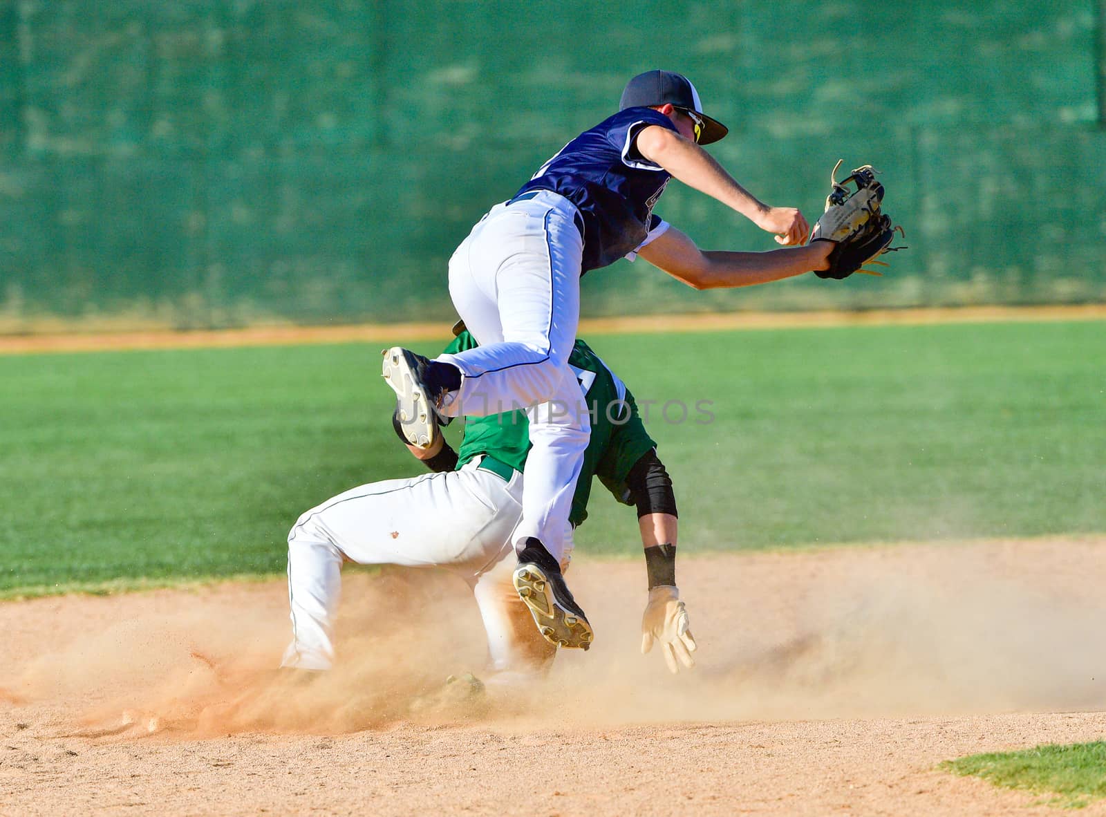 Young athletic boys playing baseball by Calomeni