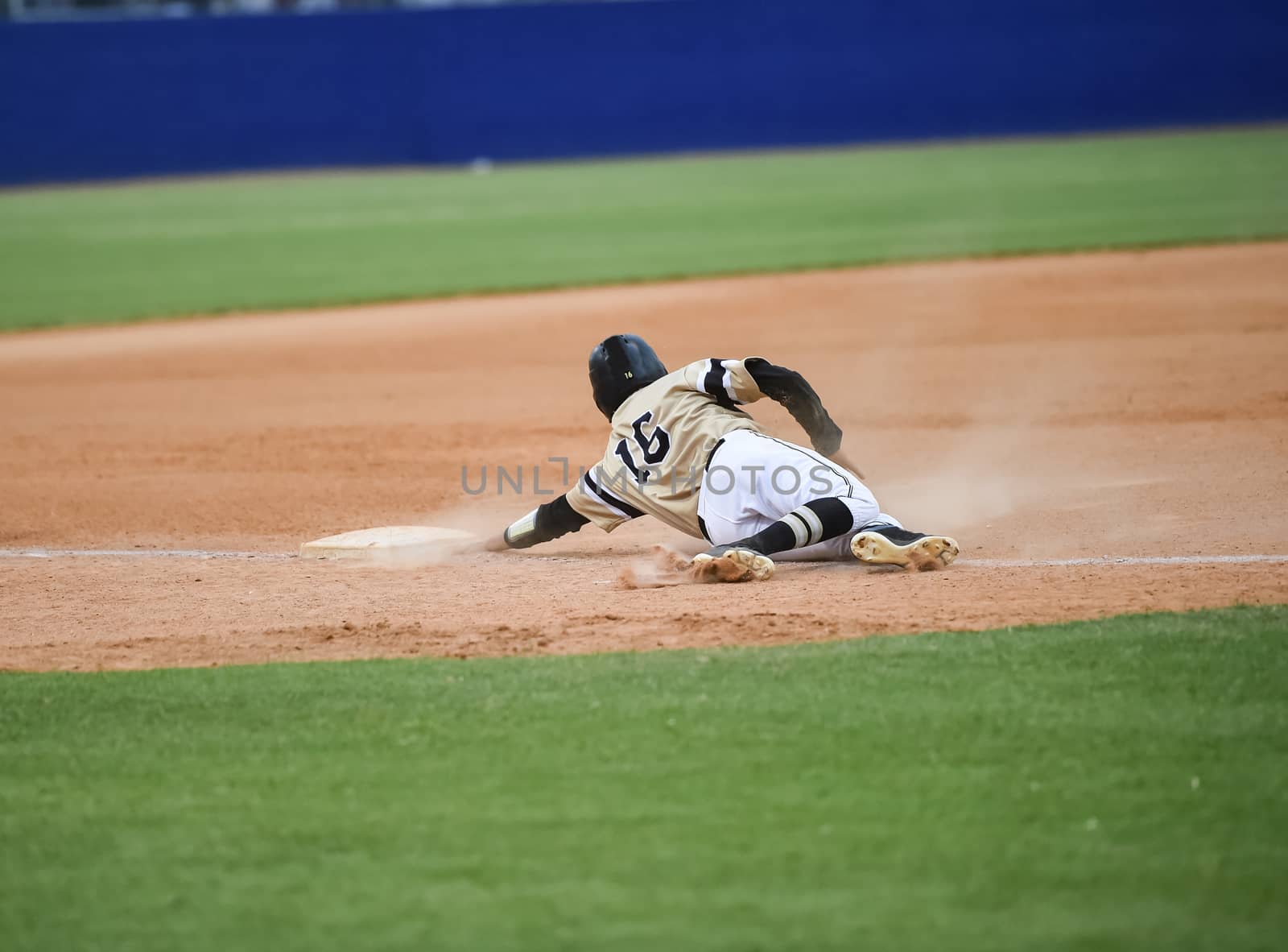 Action photo of high school baseball players making amazing plays during a baseball game