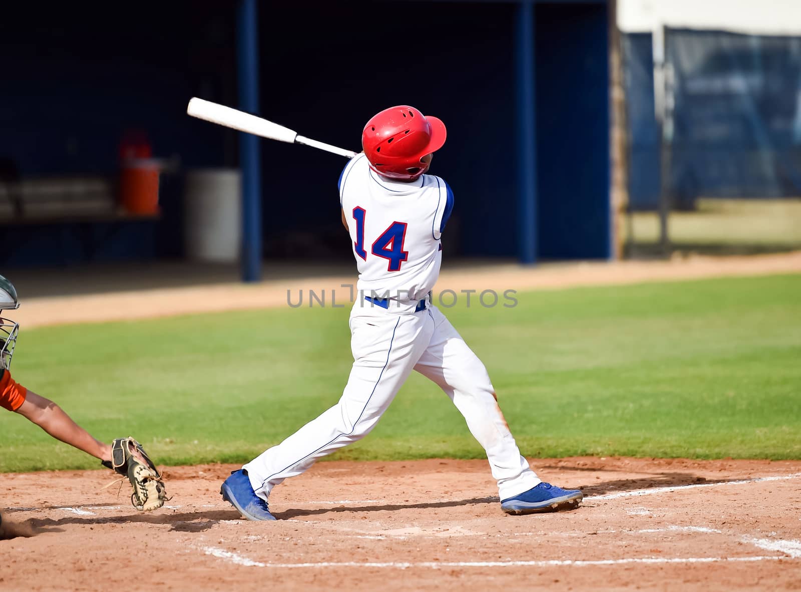 Action photo of high school baseball players making amazing plays during a baseball game