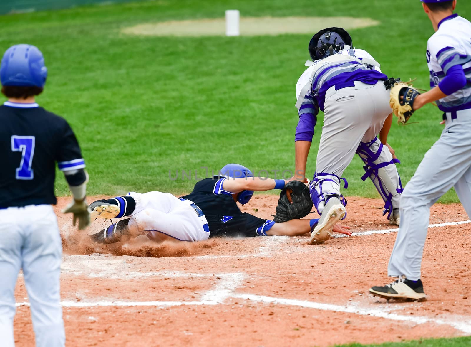 Young athletic boys playing baseball by Calomeni