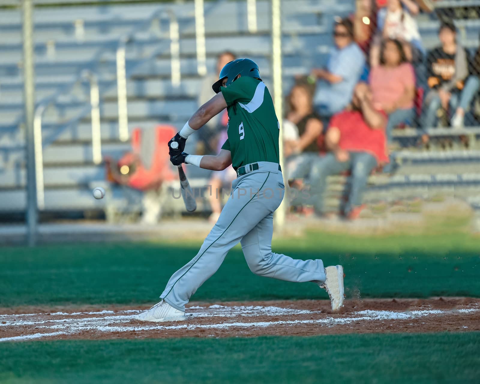 Action photo of high school baseball players making amazing plays during a baseball game