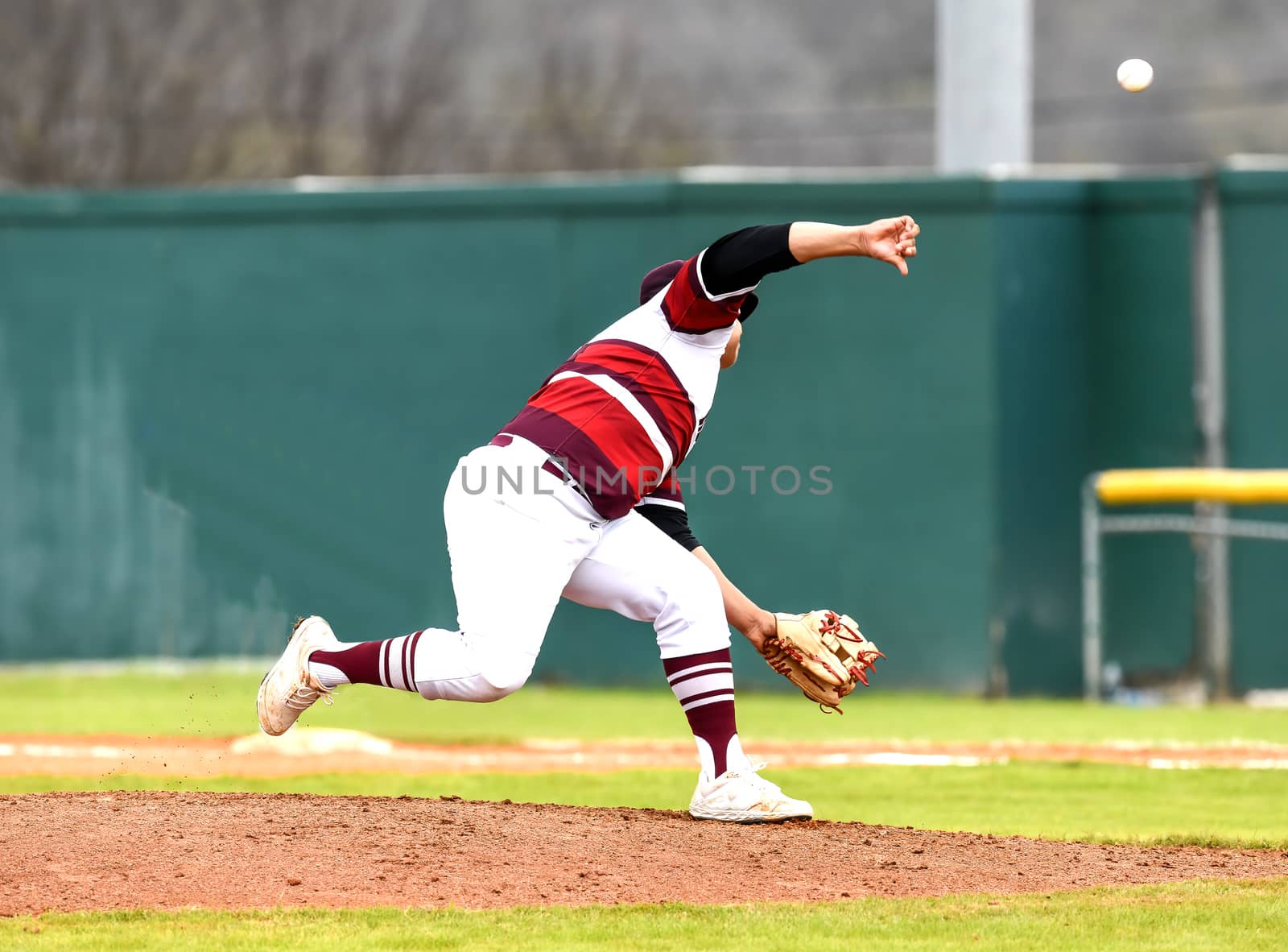 Action photo of high school baseball players making amazing plays during a baseball game