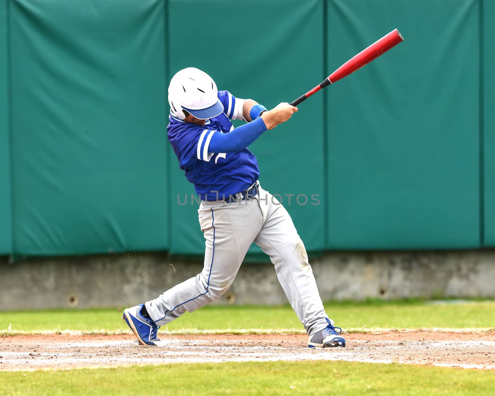 Action photo of high school baseball players making amazing plays during a baseball game