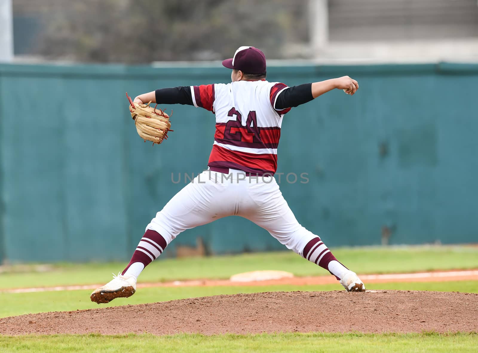 Action photo of high school baseball players making amazing plays during a baseball game