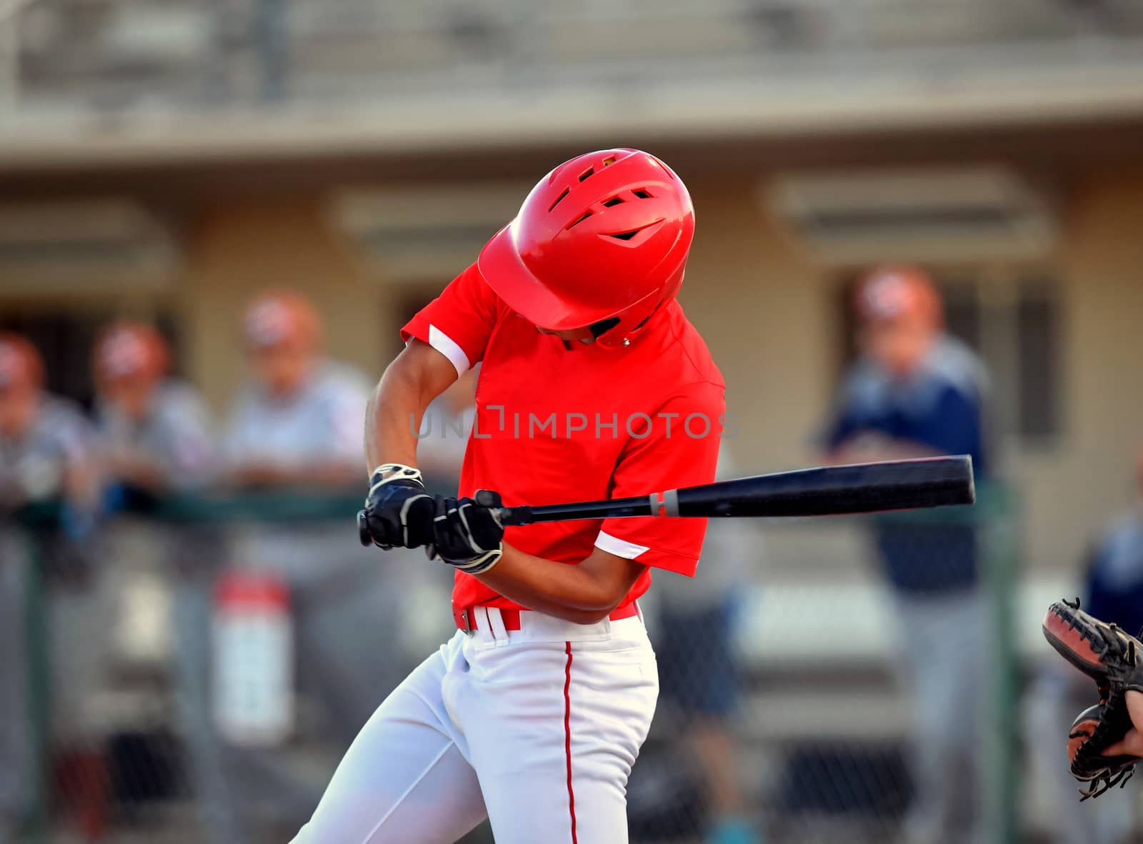 Action photo of high school baseball players making amazing plays during a baseball game