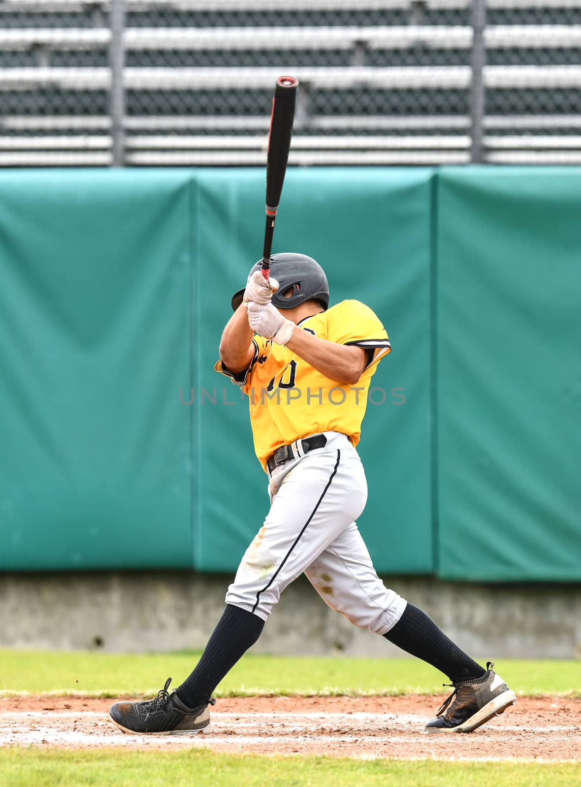 Action photo of high school baseball players making amazing plays during a baseball game