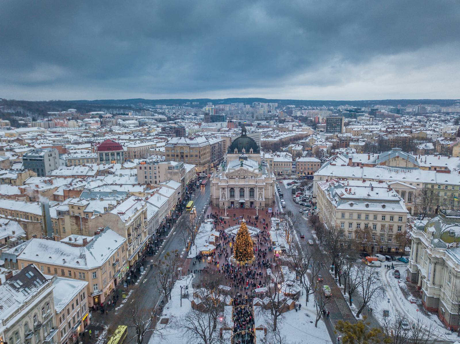 Lviv, Ukraine, December. Arial shot. Lvov Opera house. Christmas tree. Christmas Fair. People are walking around the city center