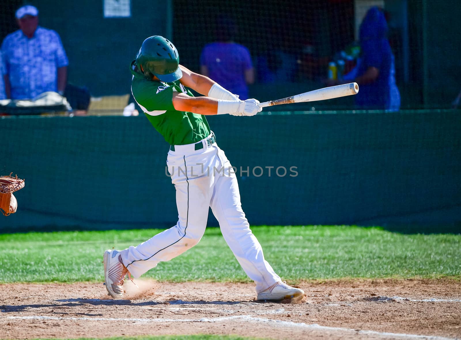 Action photo of high school baseball players making amazing plays during a baseball game