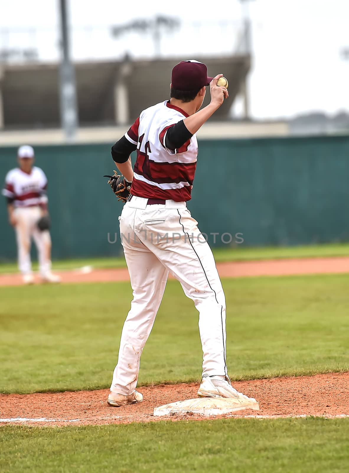 Action photo of high school baseball players making amazing plays during a baseball game