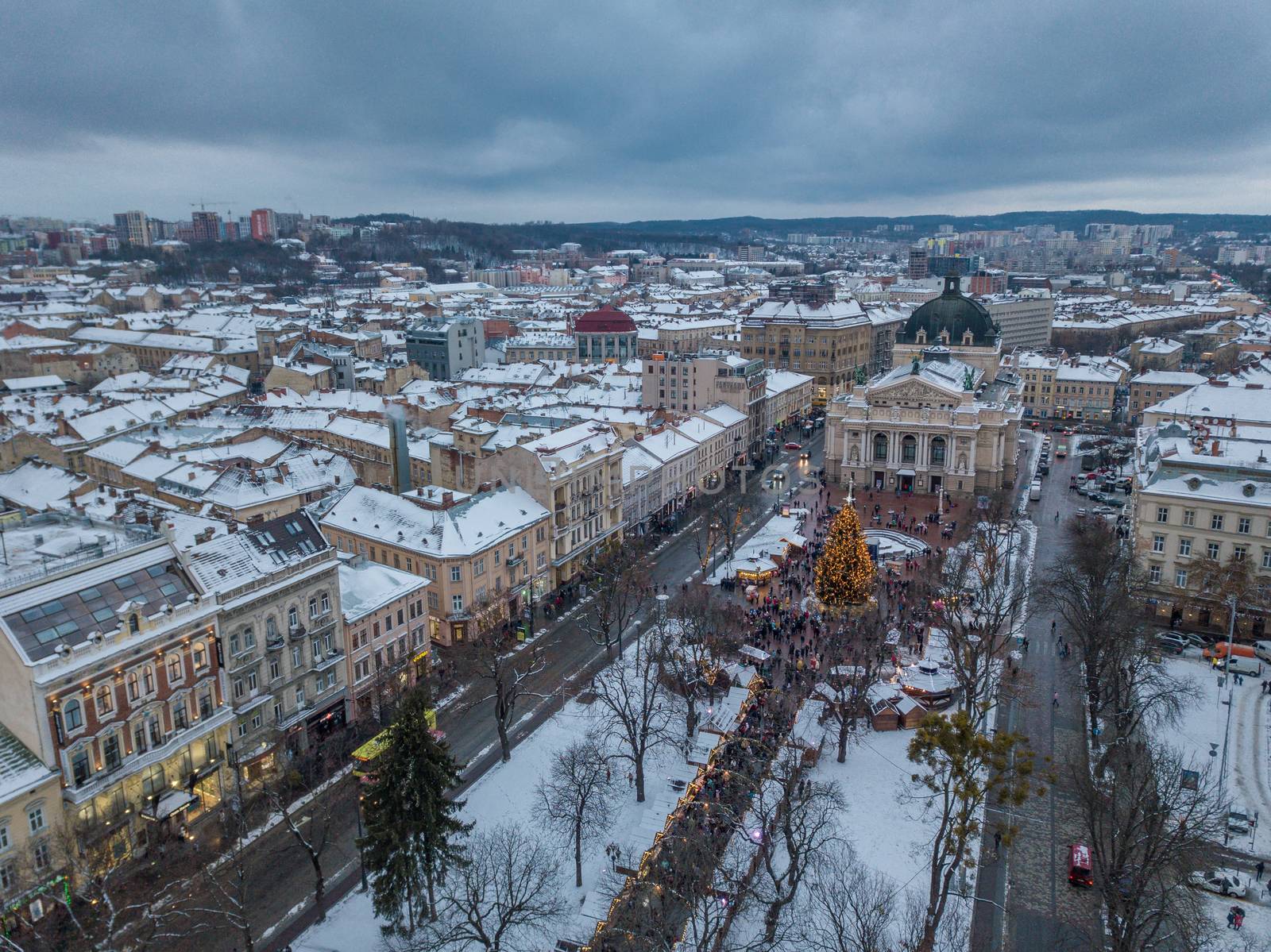 Lviv, Ukraine, December. Arial shot. Lvov Opera house. Christmas tree. Christmas Fair. People are walking around the city center