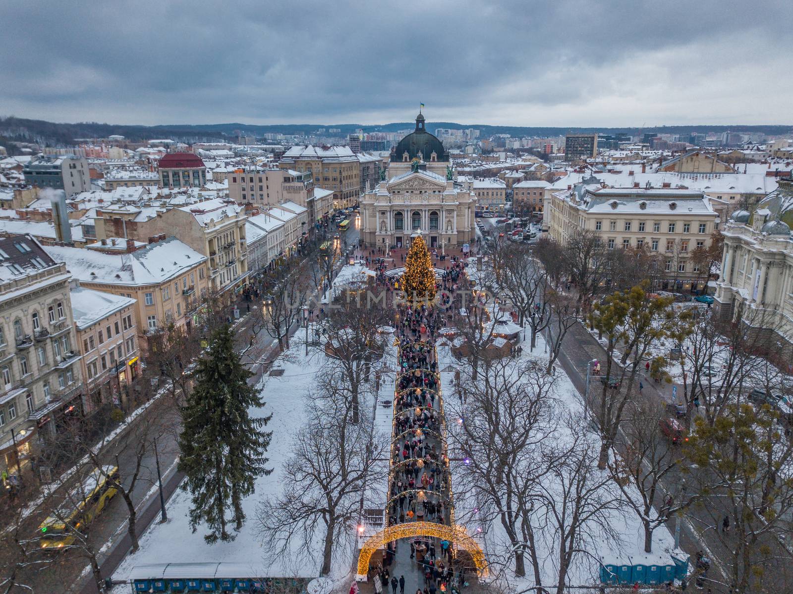 Lviv, Ukraine, December. Arial shot. Lvov Opera house. Christmas tree. Christmas Fair. People are walking around the city center