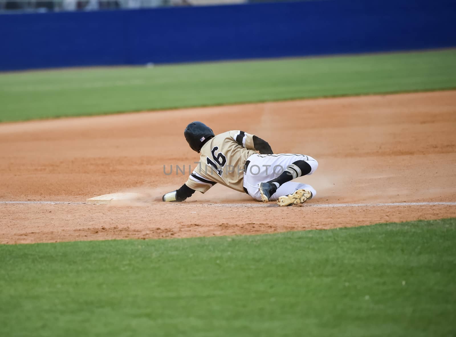 Action photo of high school baseball players making amazing plays during a baseball game