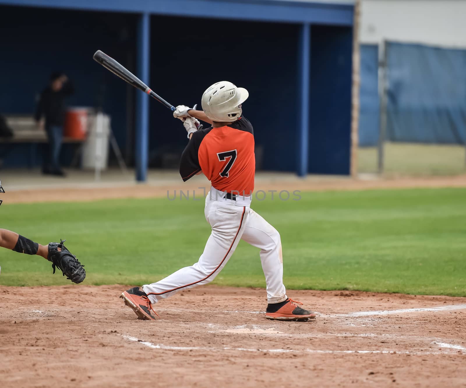 Action photo of high school baseball players making amazing plays during a baseball game