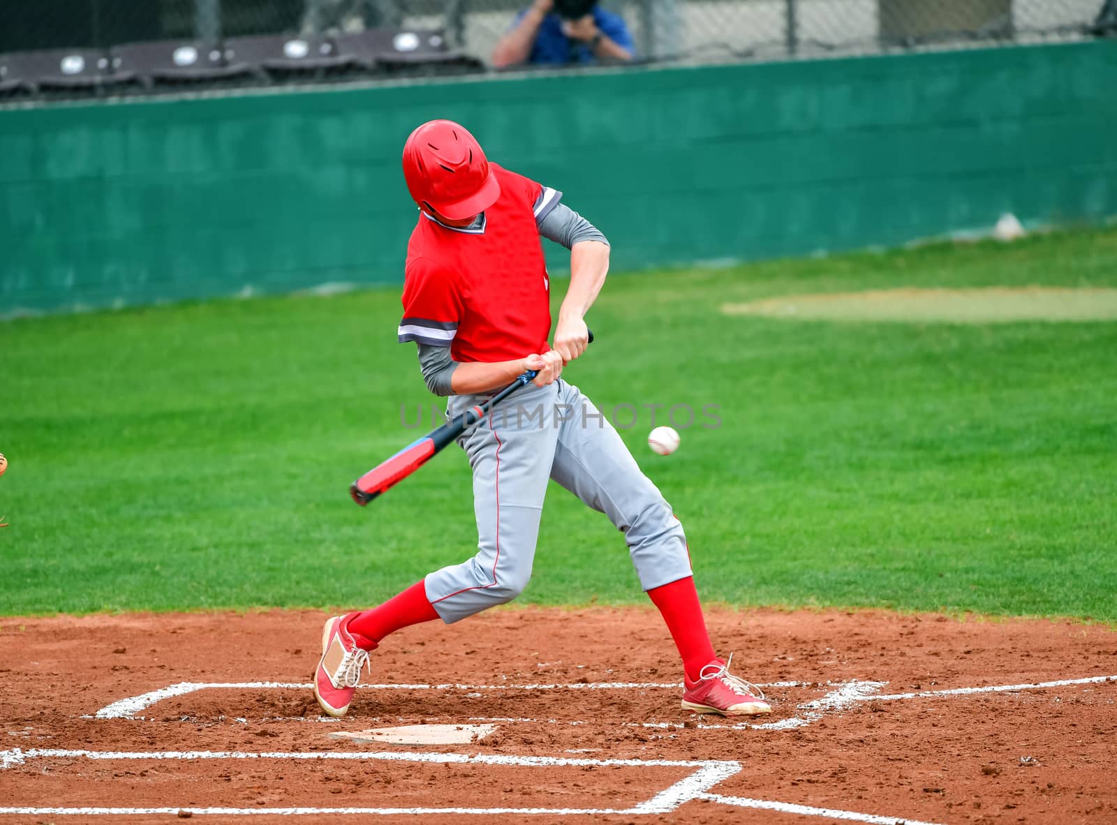 Action photo of high school baseball players making amazing plays during a baseball game