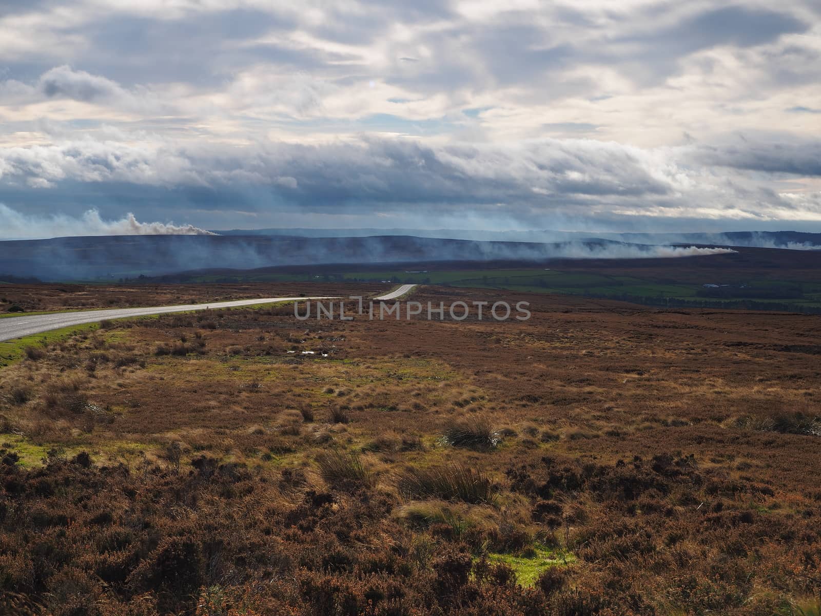 Burning of the heather in the autumn on the moors by PhilHarland