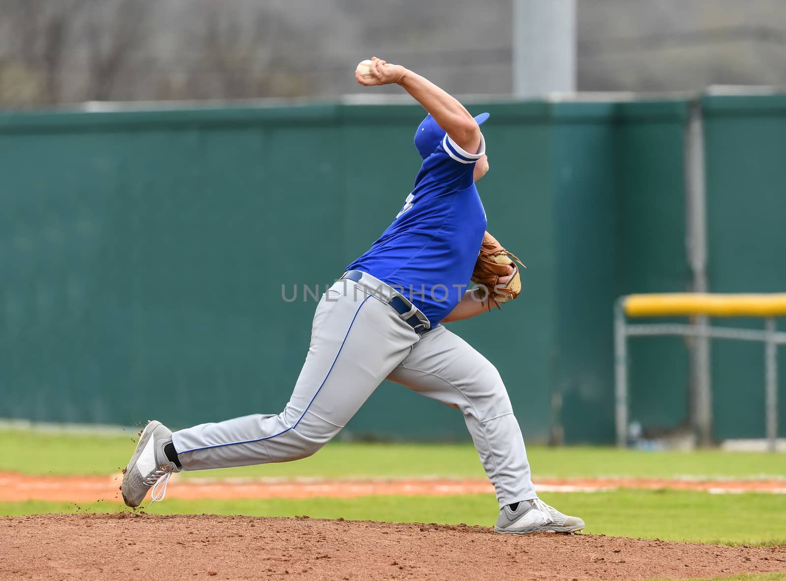 Action photo of high school baseball players making amazing plays during a baseball game