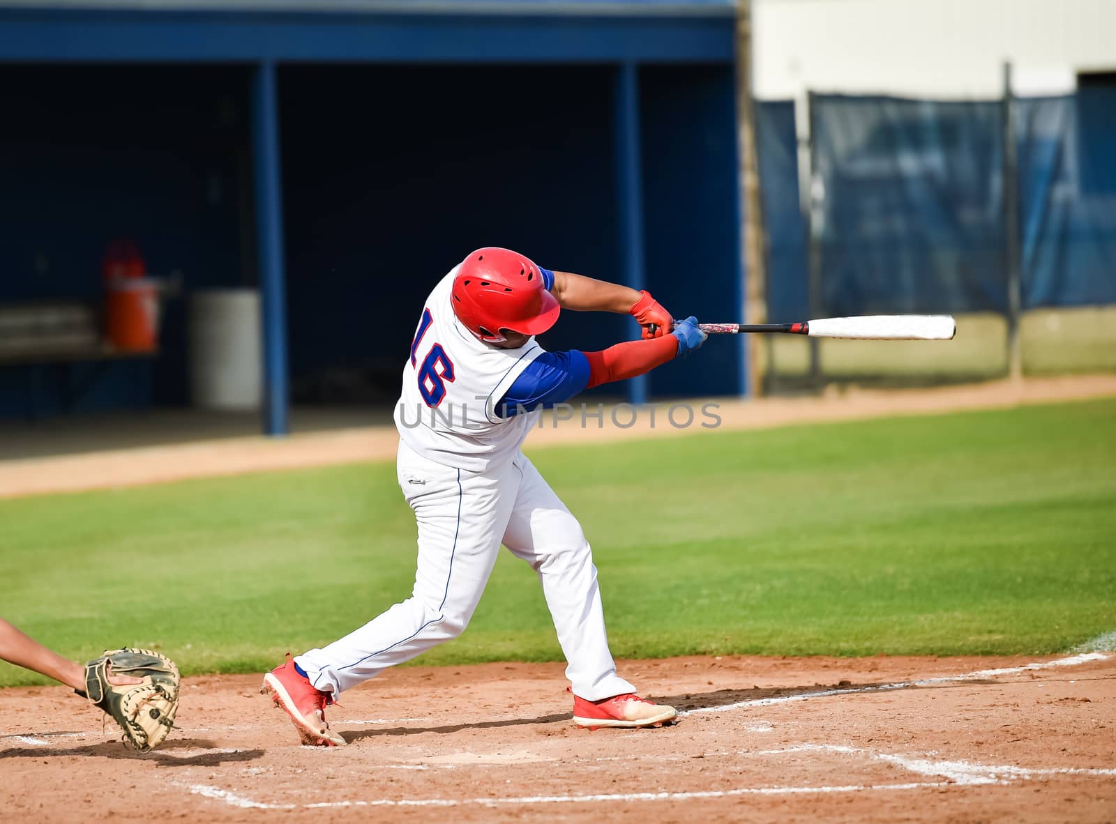 Action photo of high school baseball players making amazing plays during a baseball game