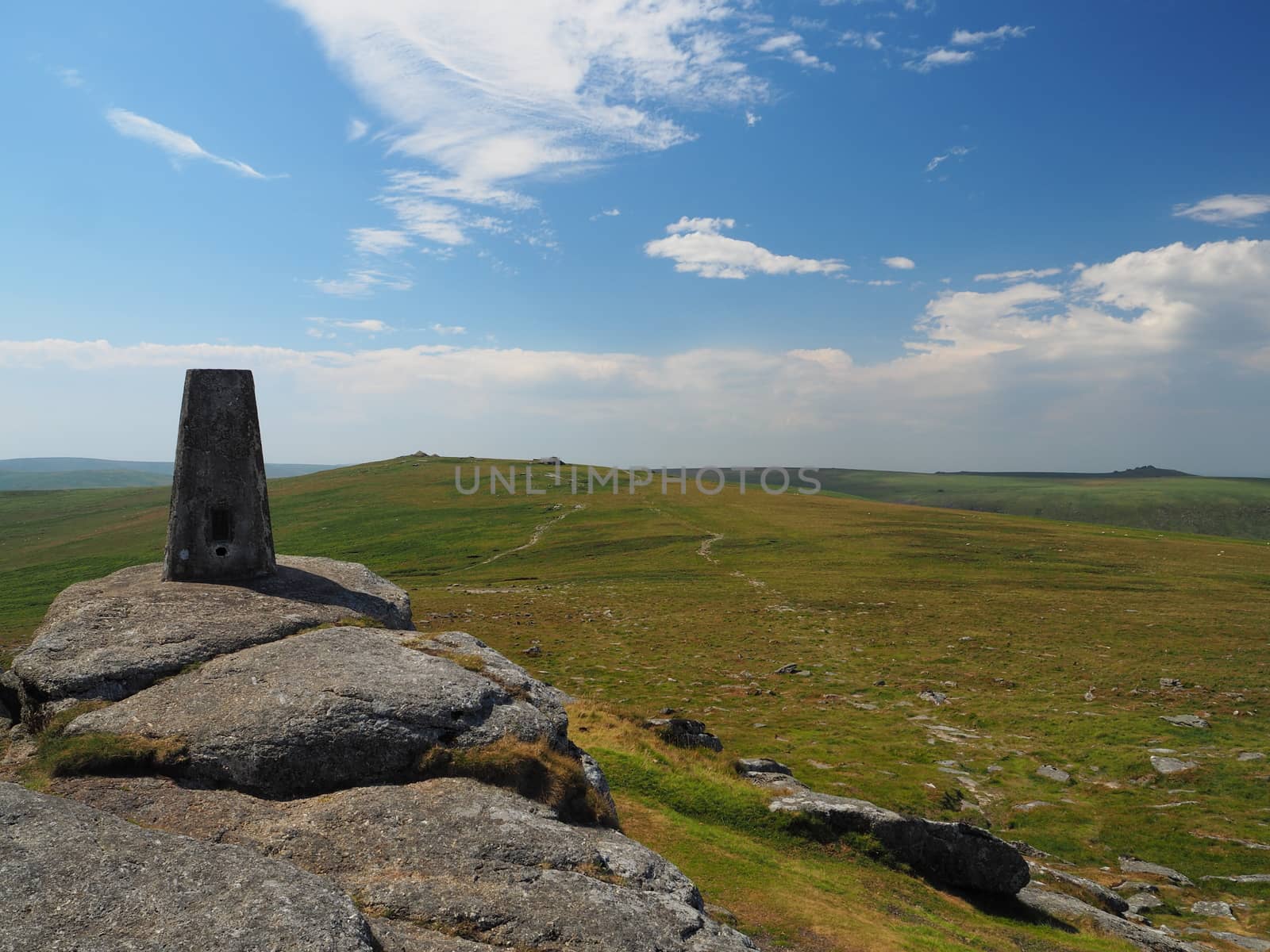Triangulation pillar on Yes Tor looking to High Willhays with blue sky, Dartmoor by PhilHarland