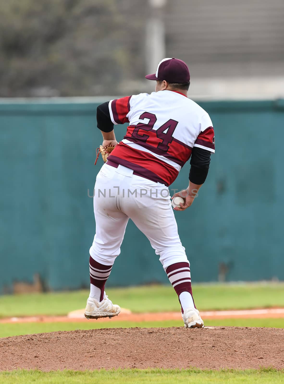 Action photo of high school baseball players making amazing plays during a baseball game