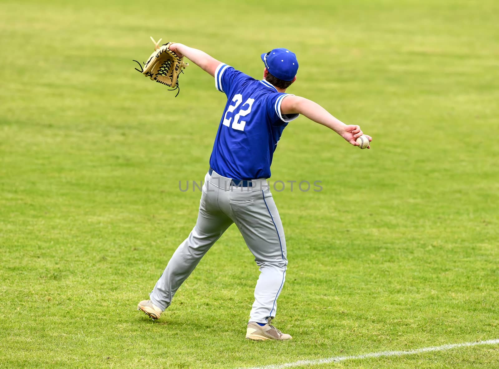 Young athletic boys playing baseball by Calomeni