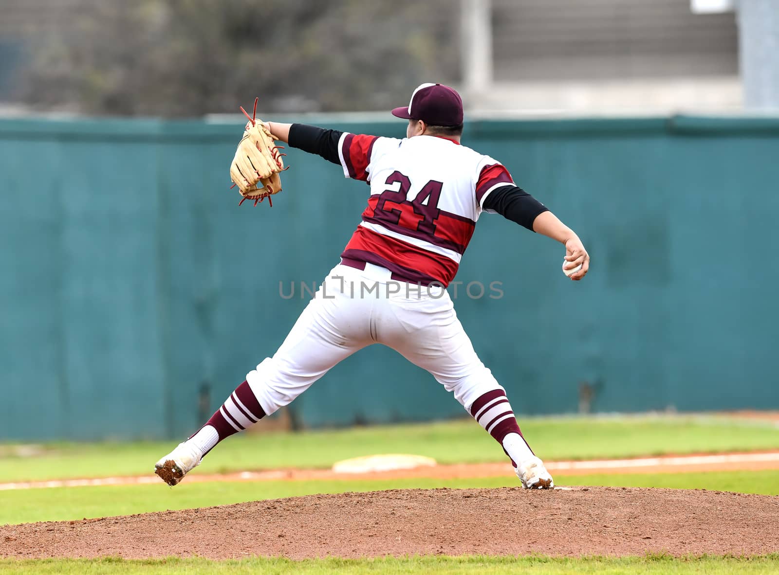 Action photo of high school baseball players making amazing plays during a baseball game