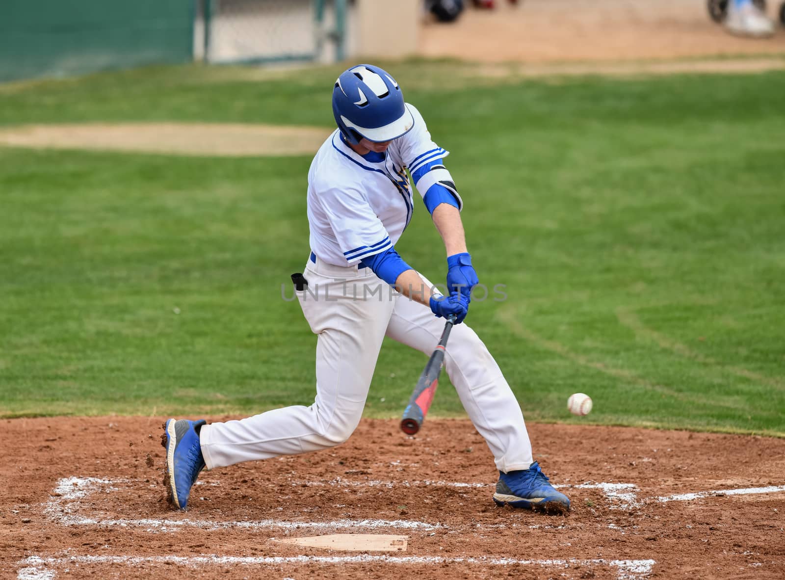 Action photo of high school baseball players making amazing plays during a baseball game