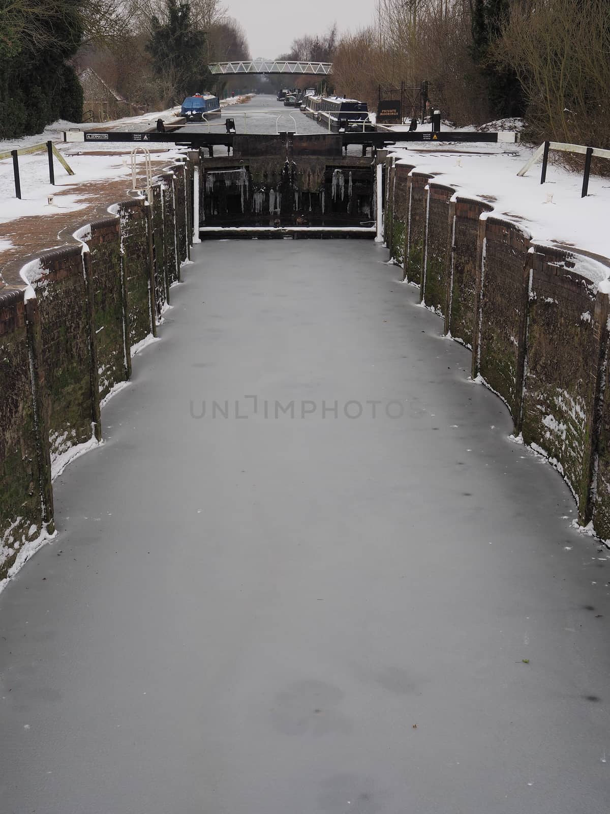 Ice in the bottom of Aldermaston Lock with canal boats, Kennet and Avon Canal by PhilHarland