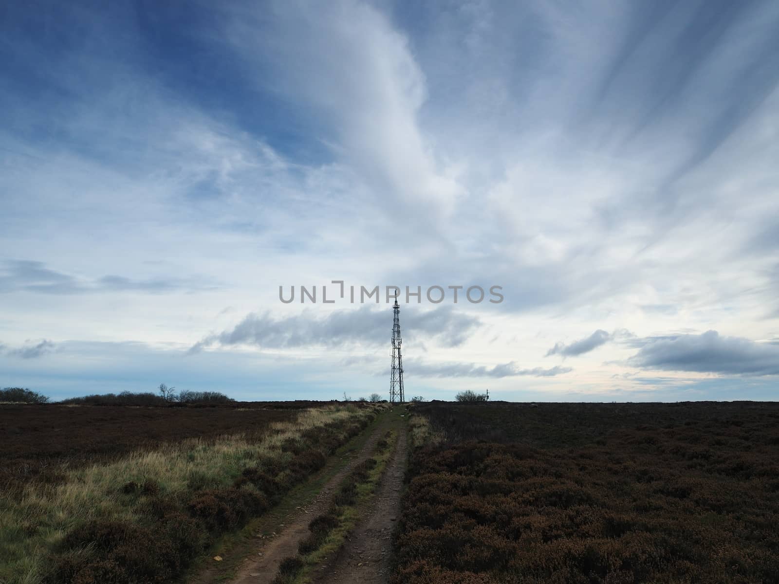 Transmitter mast viewed from Howdale Moor under brooding sky in the North York Moors National Park, Yorkshire, UK