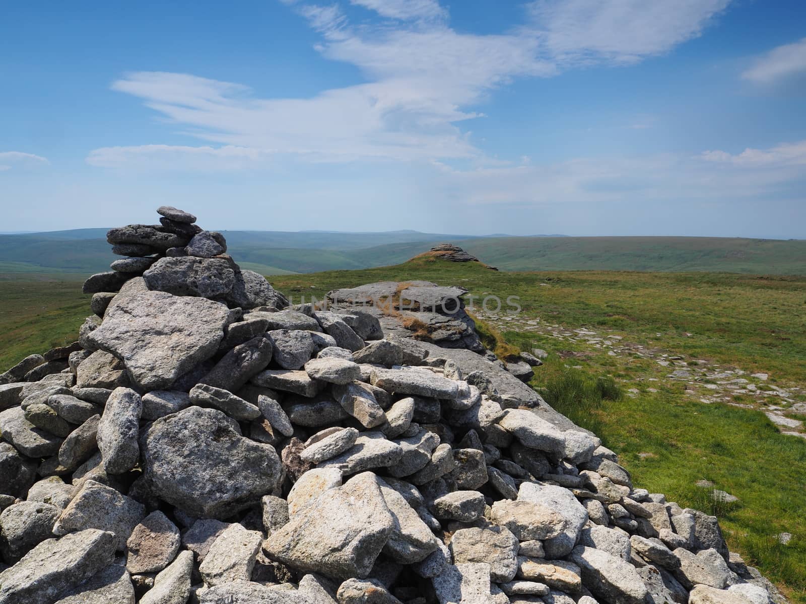 View from High Willhays cairn with white clouds in a blue sky, Dartmoor National Park, Devon, UK