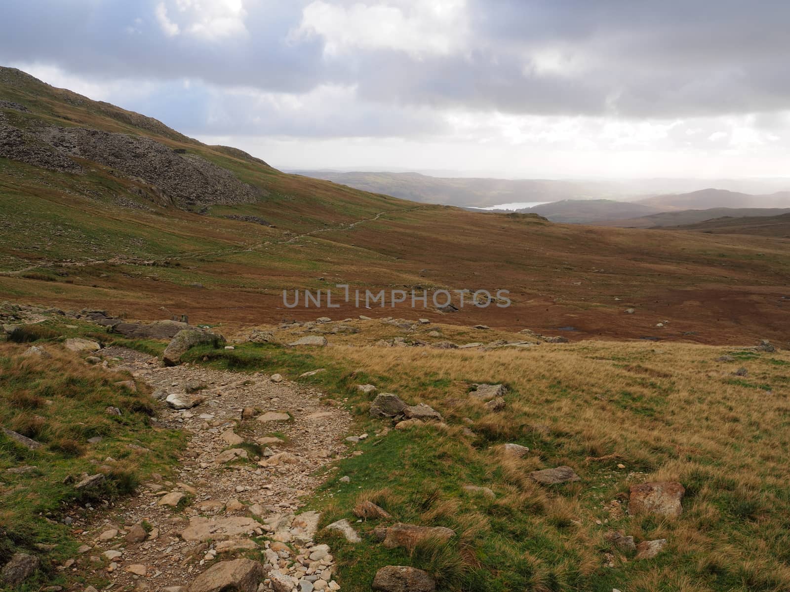Winding path over mountains with Coniston Water in distance, Lake District by PhilHarland