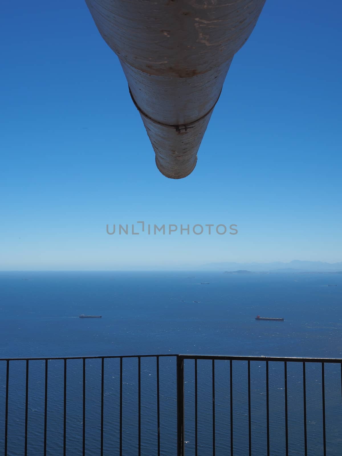 Looking down a gun barrel across the Strait of Gibraltar with the coast of Morocco in the distance