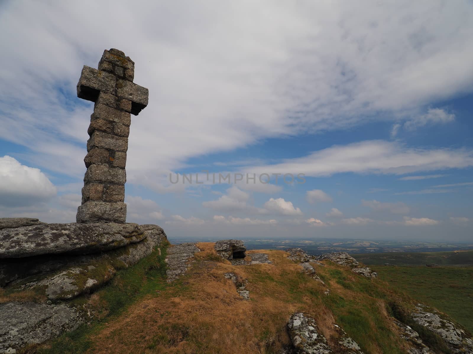 View from Brat Tor and Widgery Cross with white clouds in a blue sky, Dartmoor National Park, Devon, UK