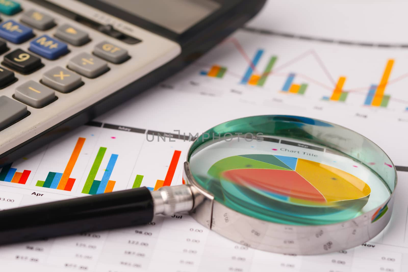 Magnifying glass on charts graphs spreadsheet paper. Financial development, Banking Account, Statistics, Investment Analytic research data economy, Stock exchange trading, Business office company meeting concept.