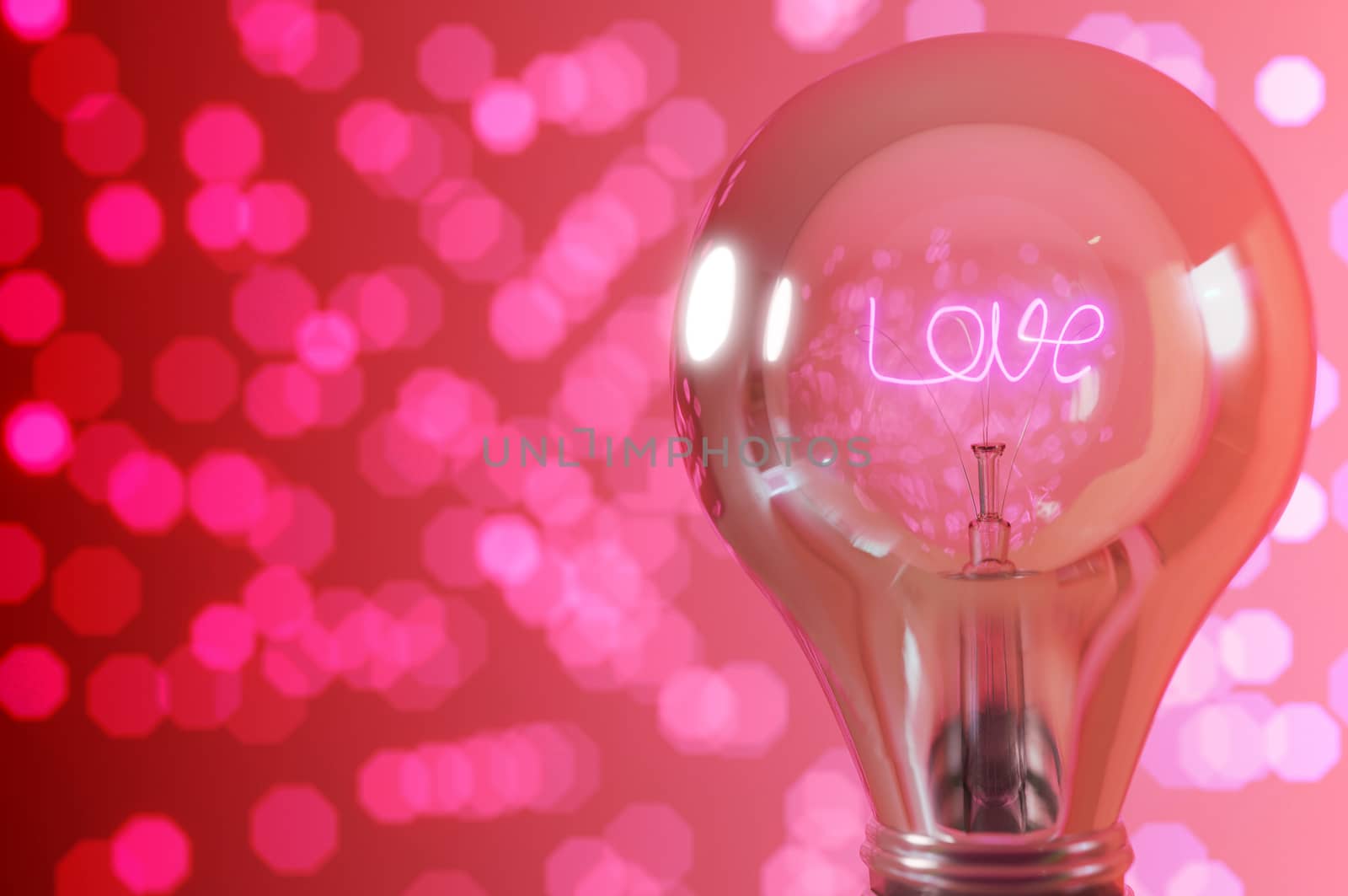 3D rendering background , Close up view, wording " love " glowing light bulb with pink bokeh background  .  Concept love , valentineday 