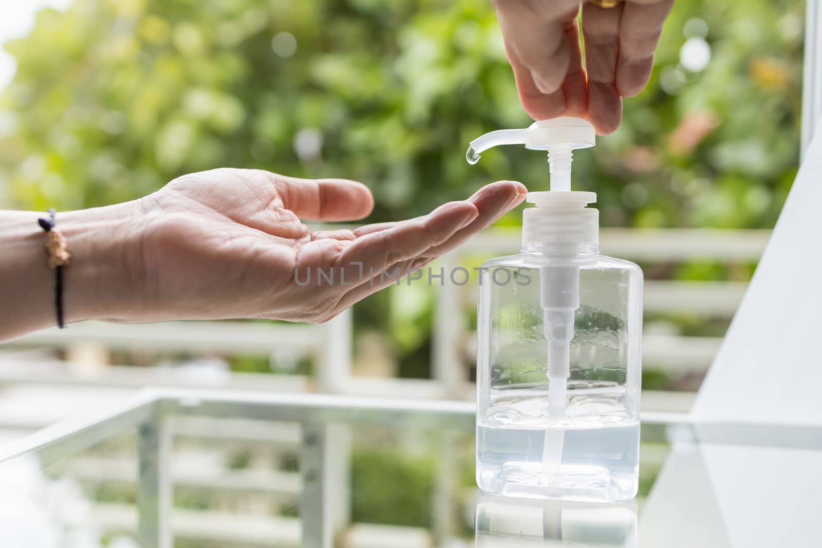 Healthcare,  Virus, Coronavirus, Covid-19, 2019-ncov Protection Concept. Close up of man hand push and using alcohol gel sanitizer on hand.