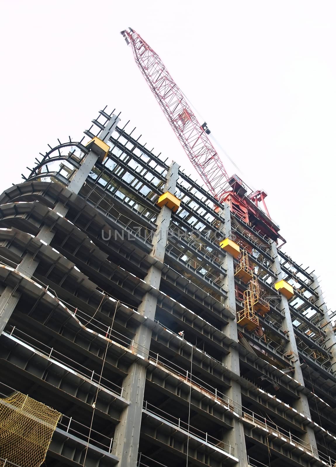 The massive steel frame of a modern building construction site