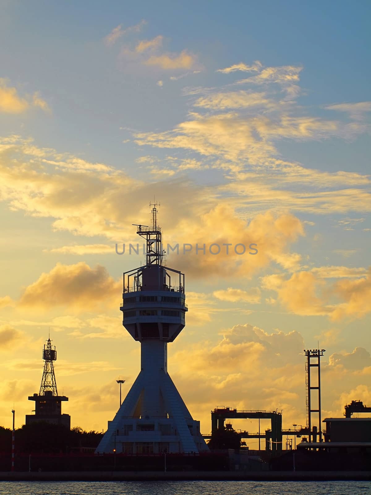 The control tower guarding the entrance to Kaohsiung port at dusk
