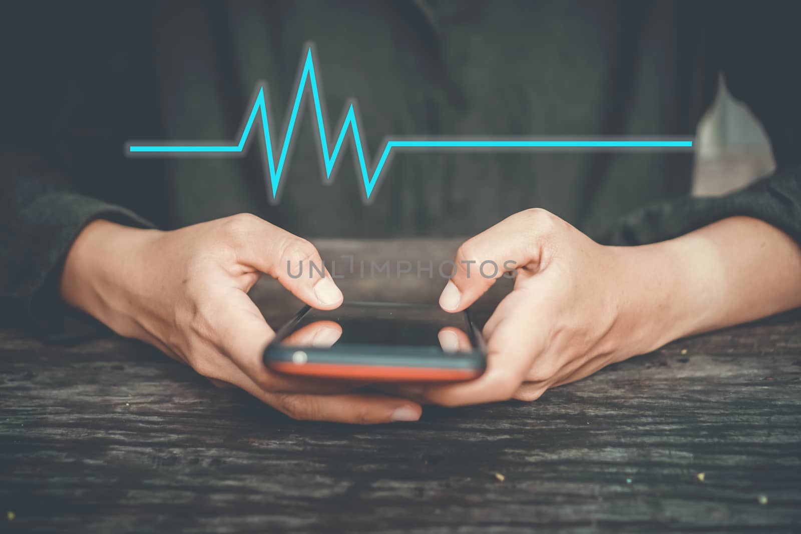 Woman hand holding smartphone with vital sign of heart beat background. Business technology health connection. by Suwant