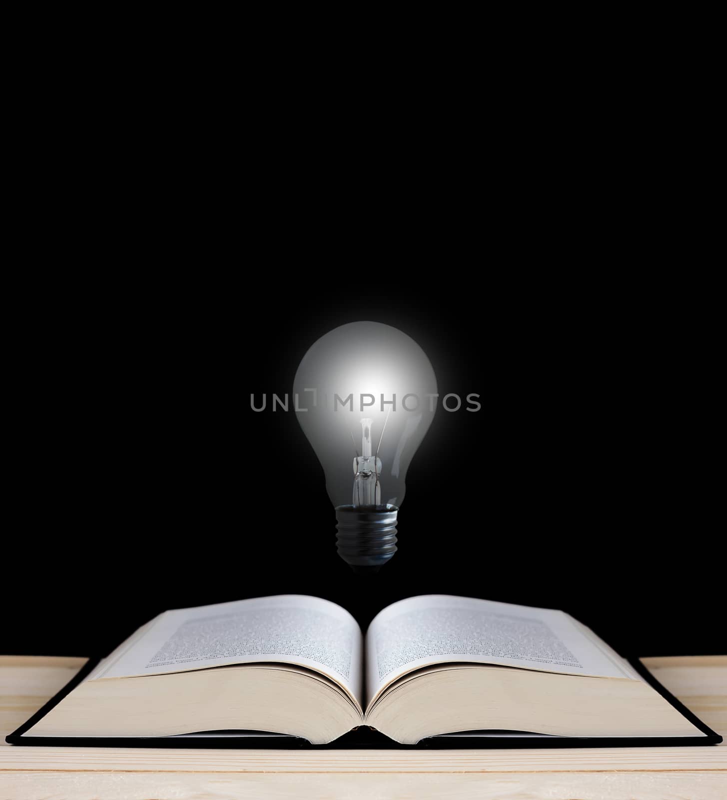 Education concept, knowledge management, light bulb and open book on chalkboard background