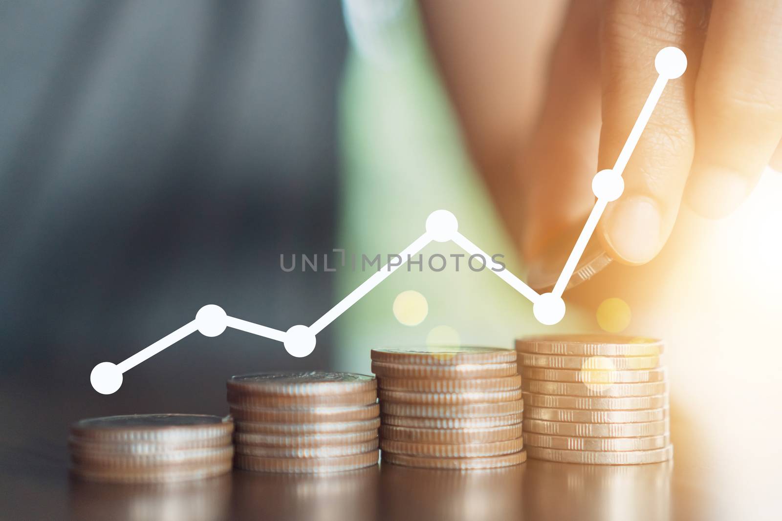 Business financial successful concept  with icon growth graph uptrend and Gold coins money stack on table. by Suwant